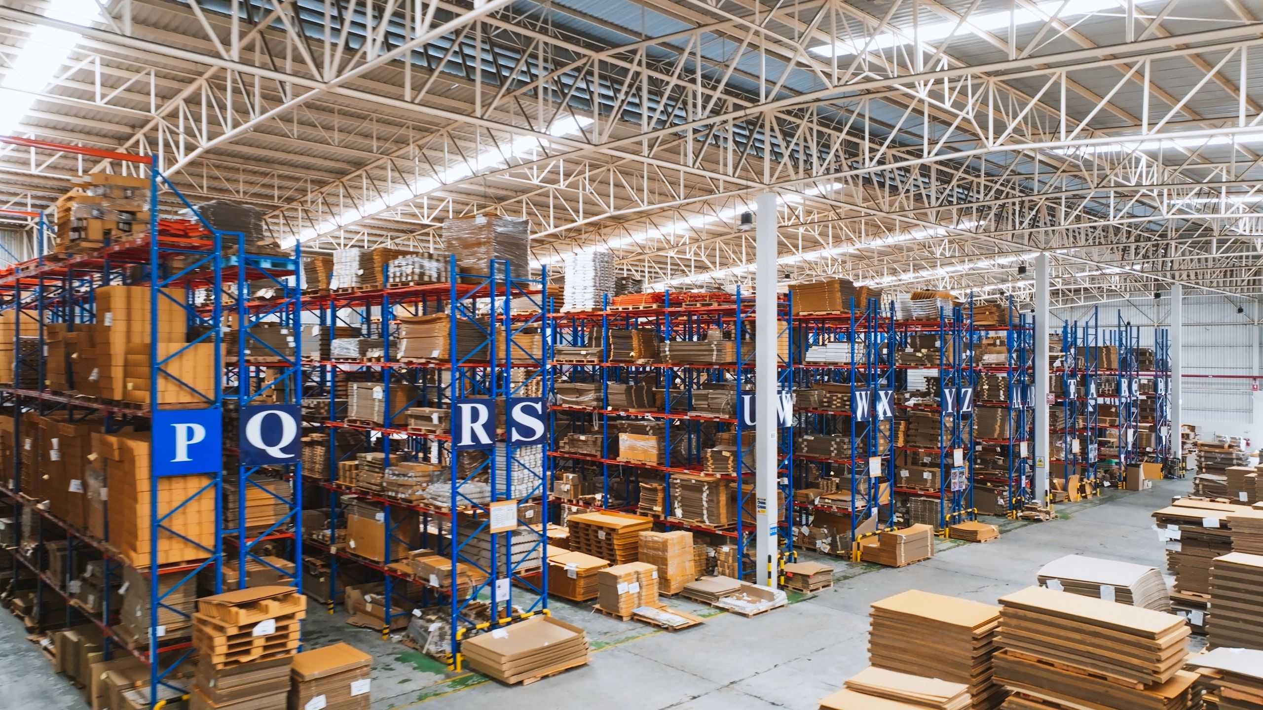 Warehouse shelves with packaged goods ready for distribution
